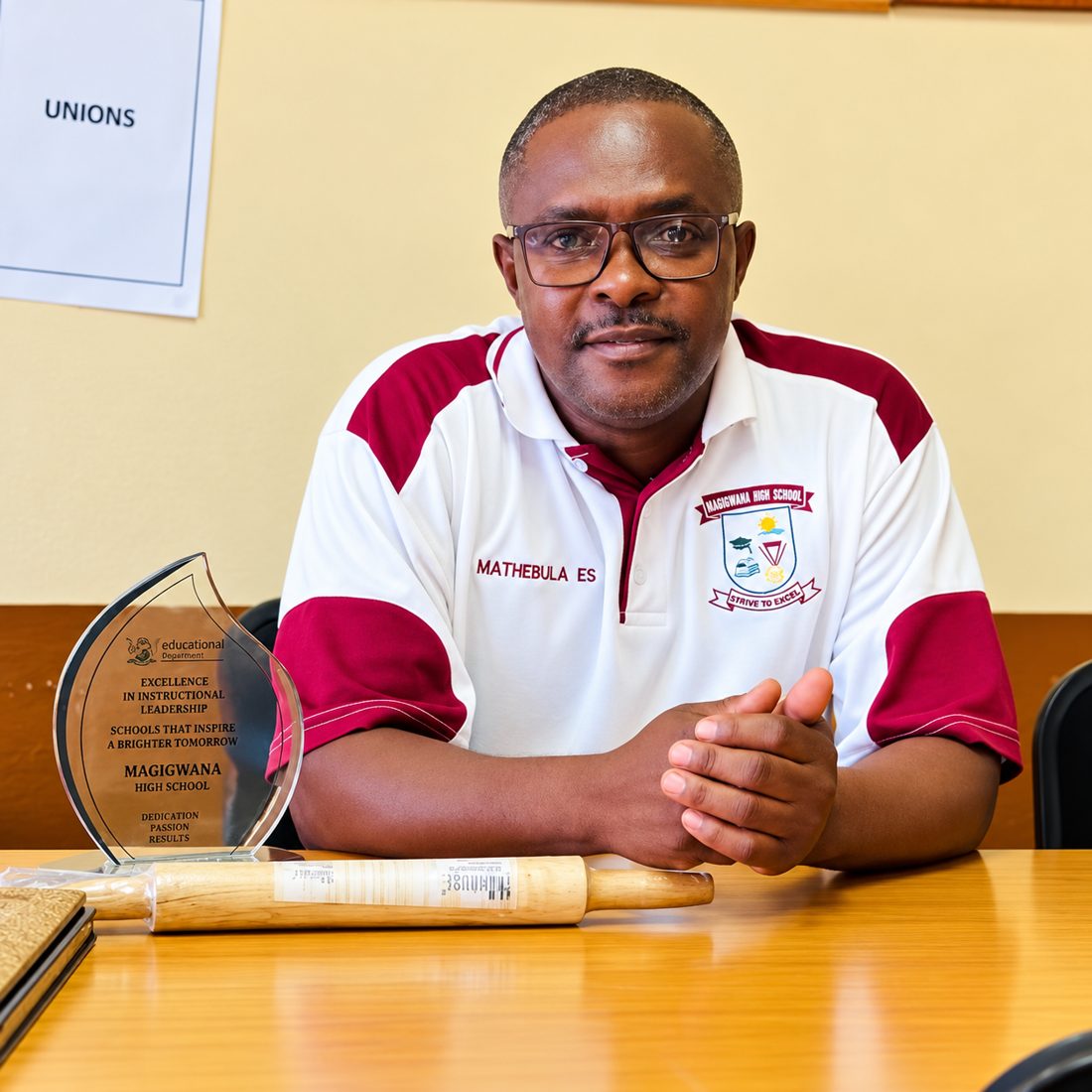 Principal E.S. Mathebula at his desk in the school office